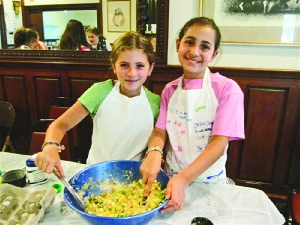  Camp activities include cooking. /Camp Gan Israel